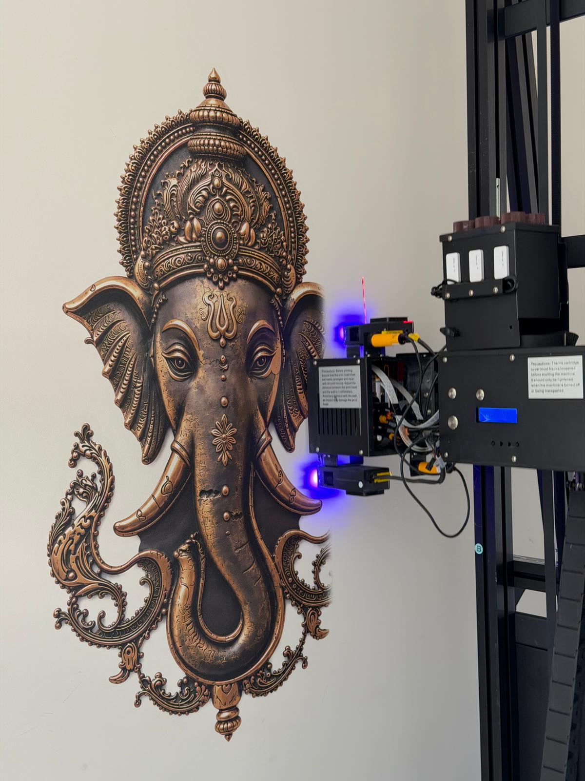 Ornate Ganesha relief artwork printed on a wall