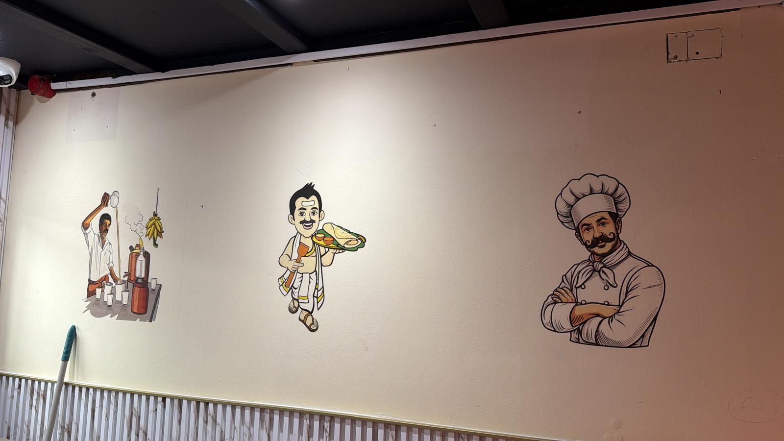 Series of character murals along a restaurant wall