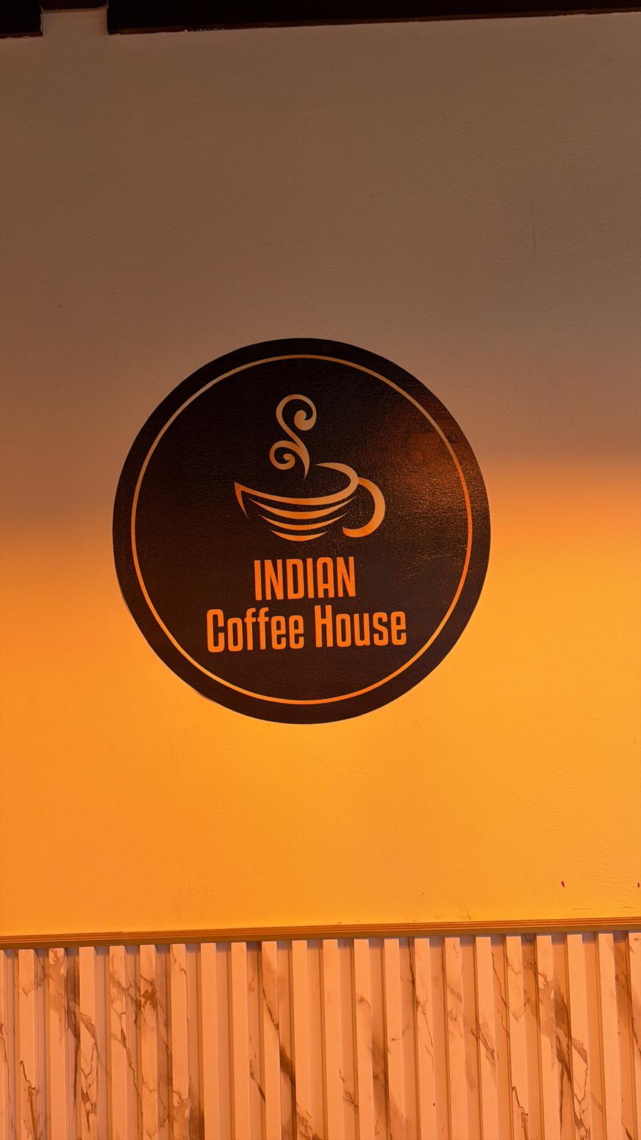 Indian Coffee House logo printed on a wall